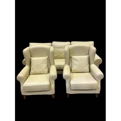 506 - A THREE PIECE LIVING ROOM SUITE comprising three seater sofa 220cm (w) and matching pair of wing bac... 
