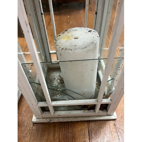 51 - A PAIR OF WHITE PAINTED AND WHITE METAL STORM LAMPS each of square form with astragal glazed panels ... 