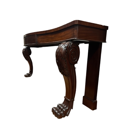 50 - A FINE 19TH CENTURY CARVED MAHOGANY CONSOLE TABLE of serpentine outline the shaped top above a friez... 
