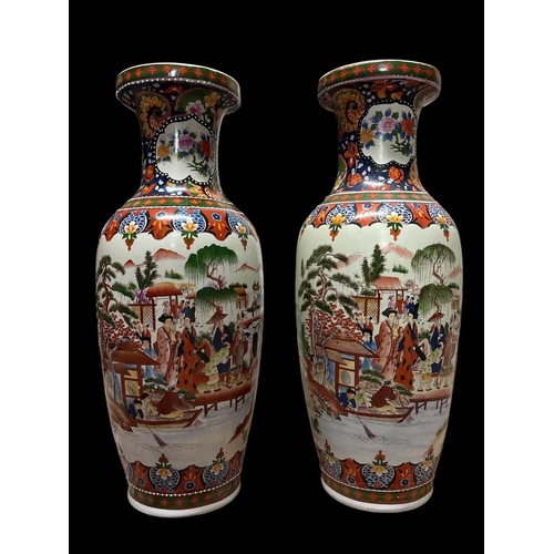 123 - A PAIR OF VINTAGE CHINESE FAMILLE ROSE VASES in polychromatic overglaze depicting a familial court s... 