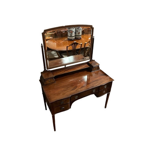383 - AN EDWARDIAN MAHOGANY INLAID DRESSING TABLE the superstructure with bevelled glass swivel mirror abo... 