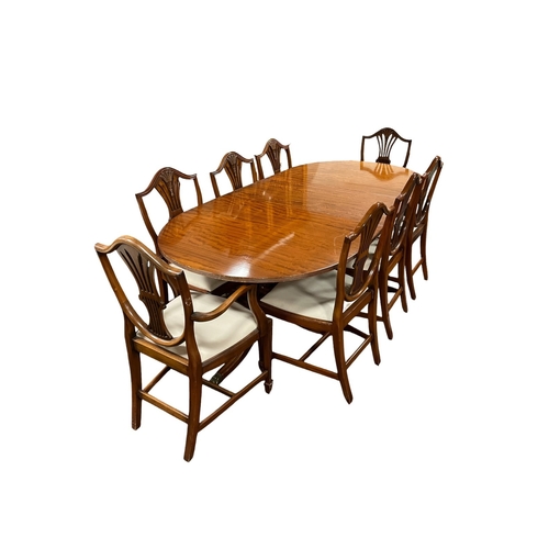 384 - A TEN PIECE MAHOGANY HEPPLEWHITE STYLE DINING ROOM SUITE comprising eight dining chairs, including a... 