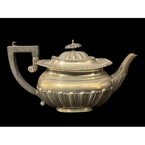 476 - A STERLING SILVER TEAPOT Birmingham 1939 585g (18.8 troy oz) Total weight including handle and finia... 