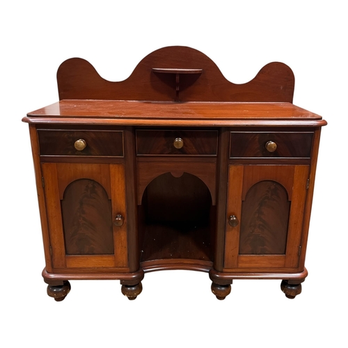 572 - A VINTAGE MAHOGANY COTTAGE SIDEBOARD with three frieze drawers over an open fronted compartment and ... 