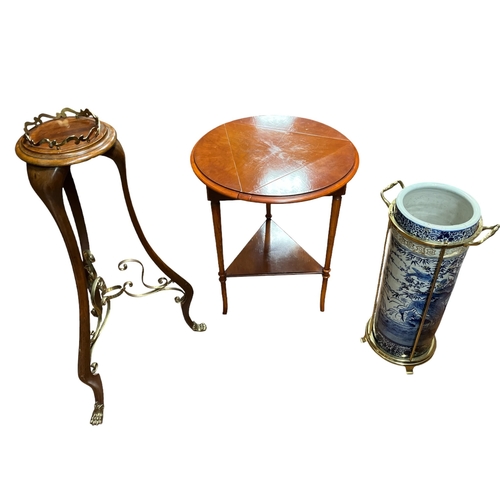 584 - AN ORIENTAL BLUE AND WHITE STICK STAND (AF) on a brass stand with carrying handles, a mahogany and b... 