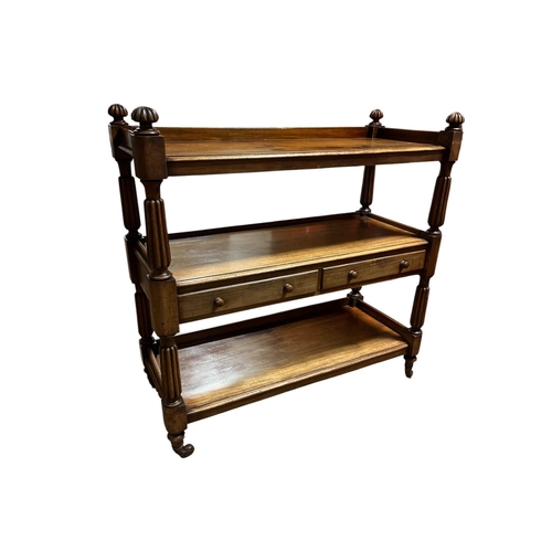 64 - A REGENCY MAHOGANY DUMBWAITER of rectangular outline the shaped top with moulded three quarter galle... 