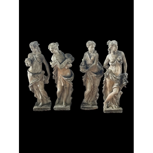 755 - A SET OF FOUR NEO-CLASSICAL STYLE STONE COMPOSITE STATUES modelled as the four seasons in personifie... 