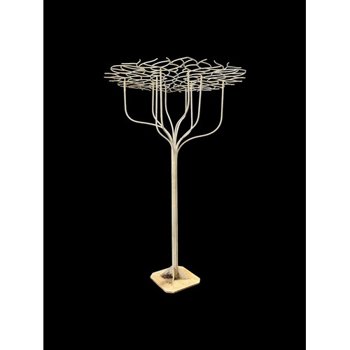 A WROUGHT IRON TREE GARDEN SCULPTURE in two parts made up of a trunk with ten protruding branches on a square form base and a pierced canopy top of circular outline 248cm (h) x 170cm (d)