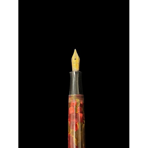 487 - A VINTAGE BURNHAM FOUNTAIN PEN AND MECHANICAL PENCIL SET in a daubed burgundy and gold toned resin c... 