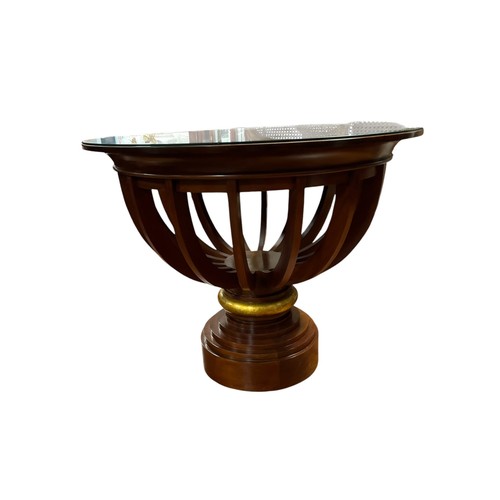 216 - A DESIGNER MAHOGANY CROSSBANDED AND PARCEL GILT CENTRE TABLE the circular top above slatted openwork... 