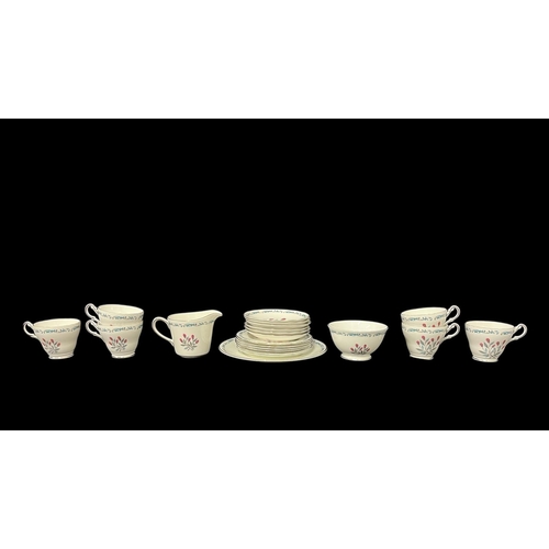 429 - A ROYAL IMPERIAL PART TEA SET with scrolled foliate decoration and red floral motifs (21)