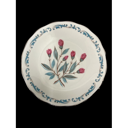 429 - A ROYAL IMPERIAL PART TEA SET with scrolled foliate decoration and red floral motifs (21)