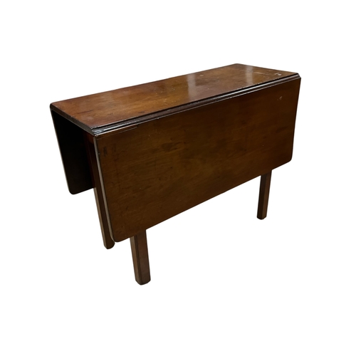 440 - A GEORGIAN MAHOGANY DROP LEAF TABLE the rectangular hinged top on square moulded legs 71cm (h) x 37c... 