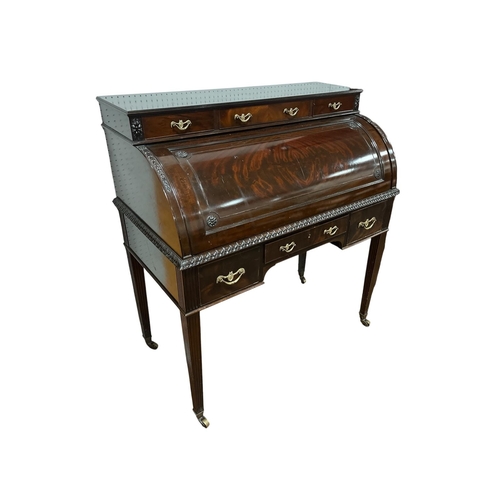 377 - A GOOD HEPPLEWHITE STYLE MAHOGANY CYLINDER FRONT DESK the superstructure with three short drawers ab... 