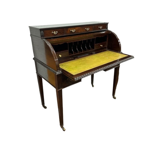 377 - A GOOD HEPPLEWHITE STYLE MAHOGANY CYLINDER FRONT DESK the superstructure with three short drawers ab... 