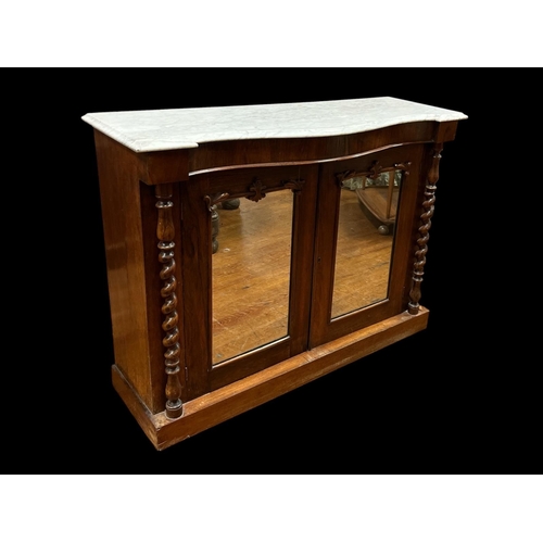 413 - A 19TH CENTURY ROSEWOOD SIDE CABINET of serpentine outline surmounted by a white veined marble top a... 