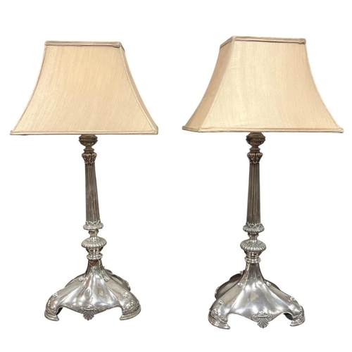 110 - A PAIR OF VINTAGE SILVER PLATED TABLE LAMPS wired for electricity, with beaded banding above a taper... 