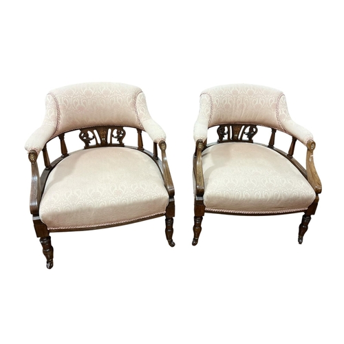 197 - A PAIR OF EDWARDIAN MAHOGANY INLAID TUB SHAPED ARMCHAIRS each with a curved back with pierced C-scro... 
