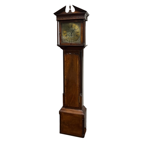 337 - A GEORGIAN MAHOGANY LONG CASED CLOCK the architectural hood containing a brass dial with Roman numer... 