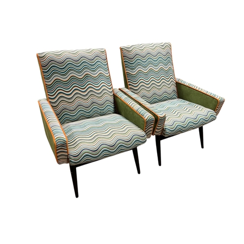 467A - A FINE PAIR OF MID-CENTURY PARKER KNOLL ARMCHAIRS with multicoloured wavy stripe upholstery on cylin... 