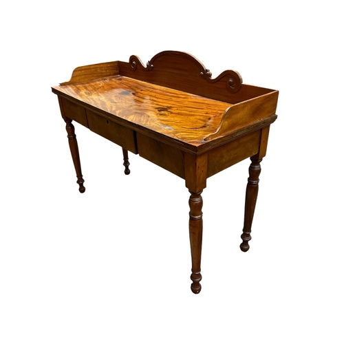 38 - A 19TH CENTURY MAHOGANY SIDE TABLE of rectangular outline with three quarter moulded gallery above t... 
