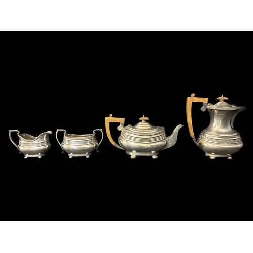 500 - A STERLING SILVER FOUR PIECE TEA AND COFFEE SERVICE comprising creamer, two handled sugar bowl, tea ... 