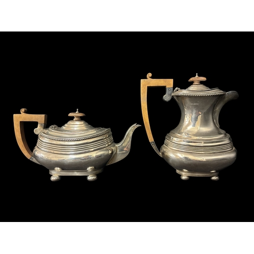 500 - A STERLING SILVER FOUR PIECE TEA AND COFFEE SERVICE comprising creamer, two handled sugar bowl, tea ... 