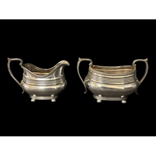 500 - A STERLING SILVER FOUR PIECE TEA AND COFFEE SERVICE comprising creamer, two handled sugar bowl, tea ... 