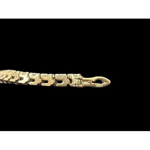 519F - A 14CT WHITE GOLD TENNIS BRACELET inset with forty-six diamonds 14g