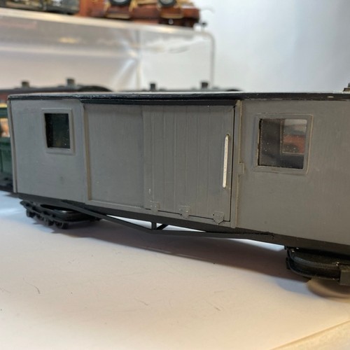 378 - 11 On16.5 wagons/coaches some with figures and another flat-bed transporting an O gauge coal wagon, ... 