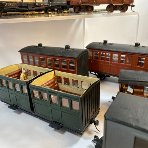 378 - 11 On16.5 wagons/coaches some with figures and another flat-bed transporting an O gauge coal wagon, ... 