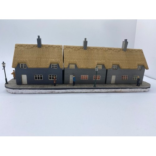 199 - Diorama 'Home sweet home' depicting a terrace of thatched cottages with gardens (1/76 scale), approx... 