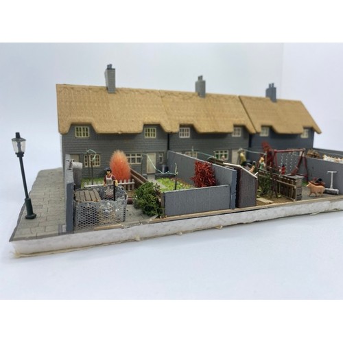 199 - Diorama 'Home sweet home' depicting a terrace of thatched cottages with gardens (1/76 scale), approx... 