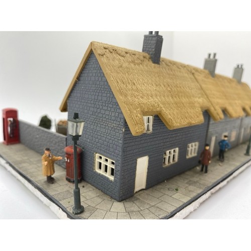 199 - Diorama 'Home sweet home' depicting a terrace of thatched cottages with gardens (1/76 scale), approx... 