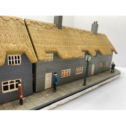 199 - Diorama 'Home sweet home' depicting a terrace of thatched cottages with gardens (1/76 scale), approx... 