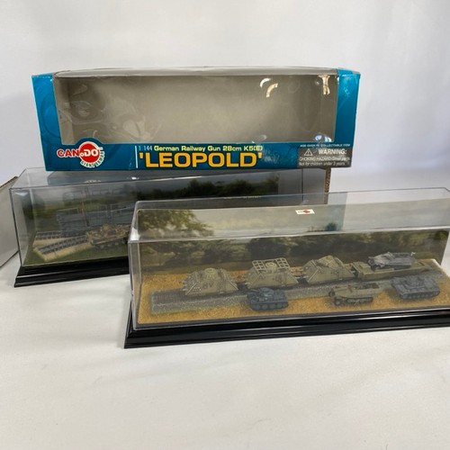 553 - Two 1:144 scale military railroad scenes in two display cases, to include Dragon Can Do 'Leopold' Ge... 