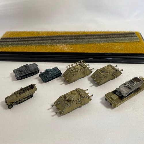 553 - Two 1:144 scale military railroad scenes in two display cases, to include Dragon Can Do 'Leopold' Ge... 