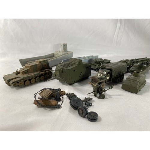 554 - 36 kit-built plastic tanks & military vehicles including two landing craft, nicely built and decorat... 