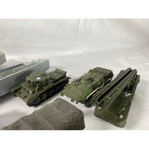 554 - 36 kit-built plastic tanks & military vehicles including two landing craft, nicely built and decorat... 