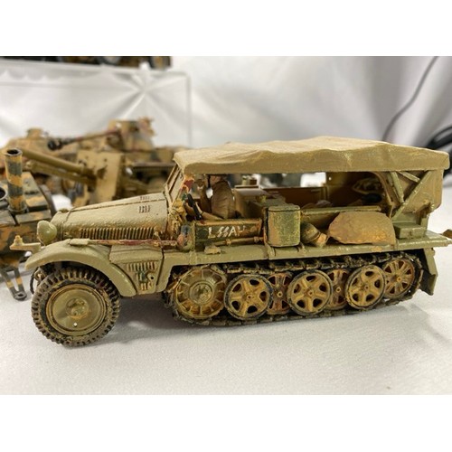 555 - 6 Kit-built plastic tanks & military vehicles and three guns, nicely built and decorated, few loose ... 