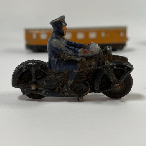 562 - Three Dinky Toys Meccano & unknown die-cast motor cyclist, includes Rail-car x2 (one damaged) and Sc... 