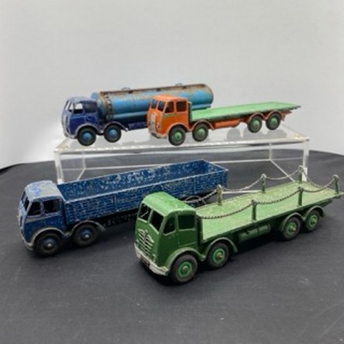 563 - Four Dinky Supertoys Foden Trucks, Dinky 905 Foden Flat Truck with Chains 2nd Type ('Angel Wing' sty... 