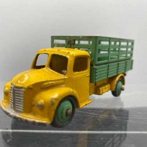 566 - Ten Dinky Toys Trucks/Wagons, Dinky Toys 343 Dodge Farm Tipper Tip Action missing Two flat tyres (F)... 