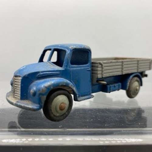 566 - Ten Dinky Toys Trucks/Wagons, Dinky Toys 343 Dodge Farm Tipper Tip Action missing Two flat tyres (F)... 