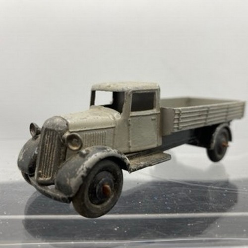 566 - Ten Dinky Toys Trucks/Wagons, Dinky Toys 343 Dodge Farm Tipper Tip Action missing Two flat tyres (F)... 