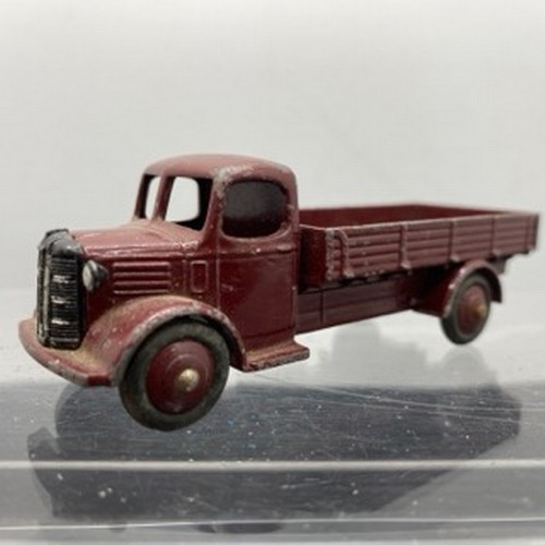 566 - Ten Dinky Toys Trucks/Wagons, Dinky Toys 343 Dodge Farm Tipper Tip Action missing Two flat tyres (F)... 