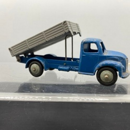 566 - Ten Dinky Toys Trucks/Wagons, Dinky Toys 343 Dodge Farm Tipper Tip Action missing Two flat tyres (F)... 