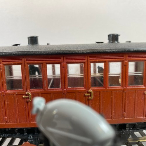 245 - 11 On16.5 wagons/coaches some with figures and another flat-bed transporting an O gauge coal wagon, ... 