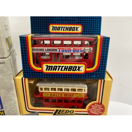 21 - Buses Galore - 8 boxed/carded plus another 13 play-worn buses/trams, includes boxed Corgi Cardiff Me... 