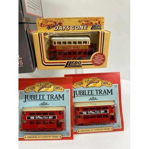 21 - Buses Galore - 8 boxed/carded plus another 13 play-worn buses/trams, includes boxed Corgi Cardiff Me... 